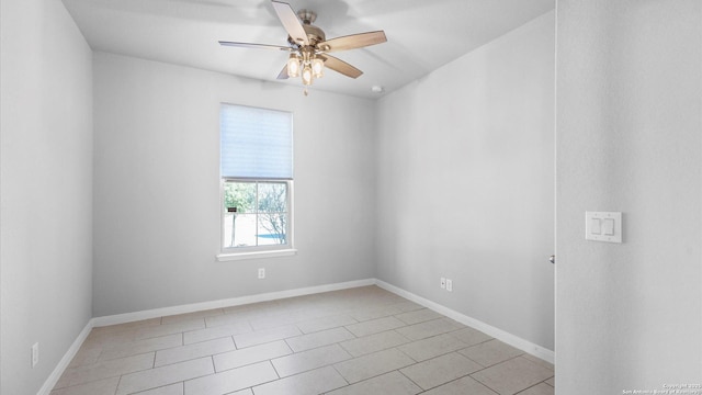 unfurnished room with ceiling fan and light tile patterned floors