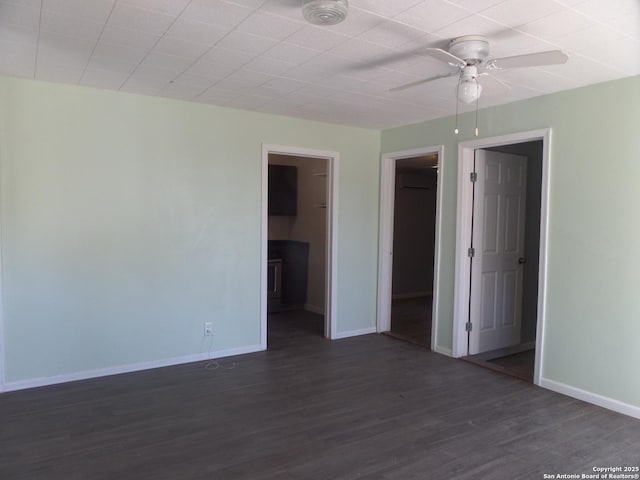 unfurnished room featuring dark hardwood / wood-style floors and ceiling fan