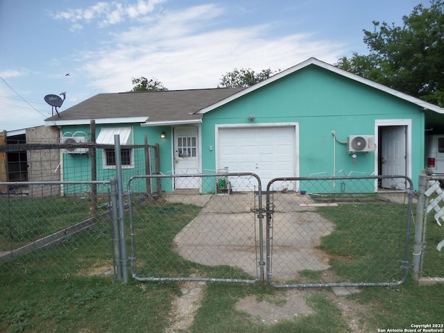 ranch-style house featuring a garage, a front lawn, and ac unit