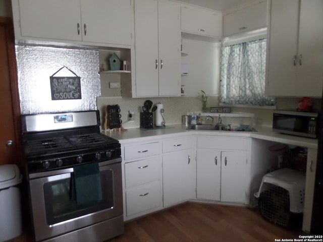 kitchen featuring white cabinetry, sink, dark hardwood / wood-style flooring, and stainless steel appliances