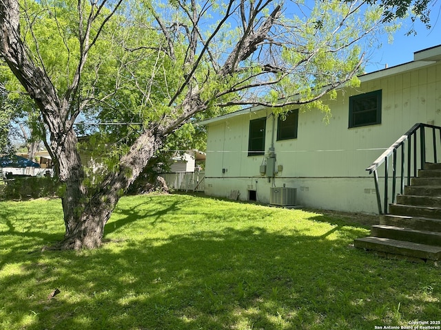 view of yard featuring central AC unit