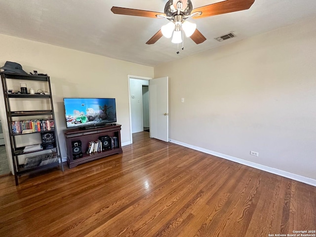 unfurnished living room featuring hardwood / wood-style flooring and ceiling fan