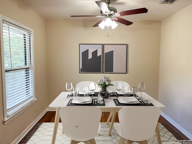 dining space featuring hardwood / wood-style flooring and ceiling fan