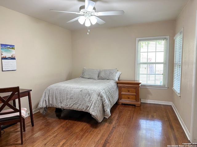 bedroom featuring dark hardwood / wood-style floors and ceiling fan