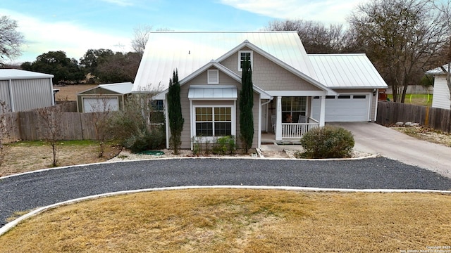 view of front of house featuring a garage and a front lawn