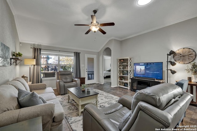 living room featuring lofted ceiling, crown molding, and ceiling fan