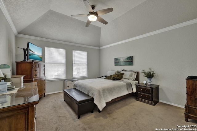 bedroom featuring lofted ceiling, crown molding, light colored carpet, a raised ceiling, and ceiling fan