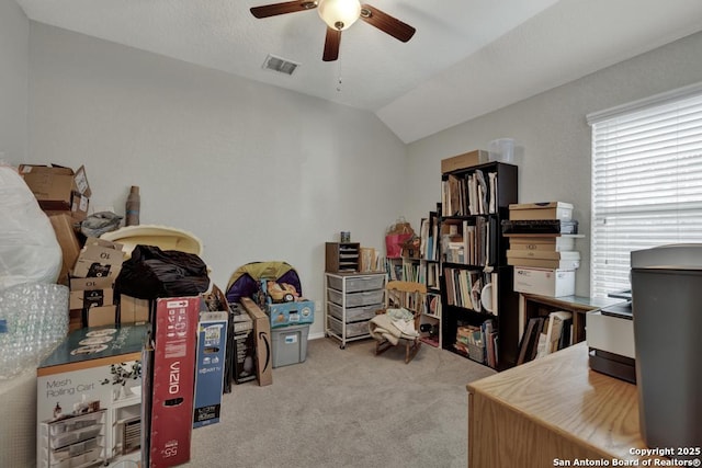 office with ceiling fan, light colored carpet, and vaulted ceiling