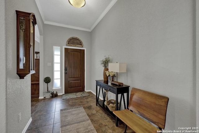 foyer featuring crown molding