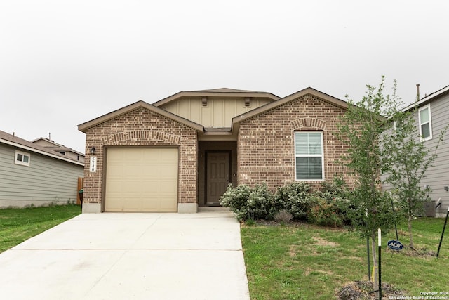 view of front facade with a garage and a front lawn