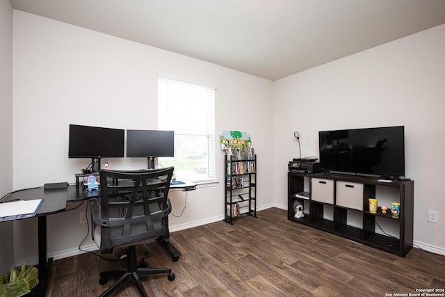 office space with dark wood-type flooring