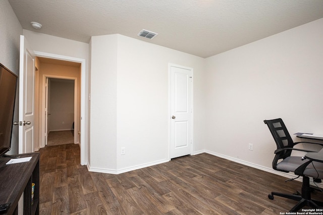 office area featuring dark hardwood / wood-style flooring and a textured ceiling