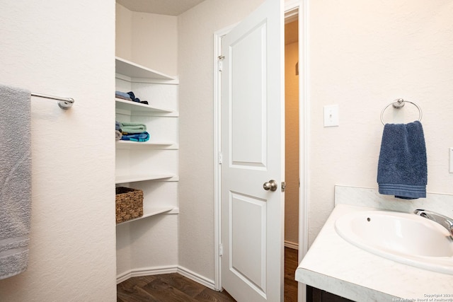 bathroom with vanity and wood-type flooring