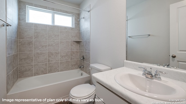 full bathroom with tiled shower / bath, vanity, and toilet