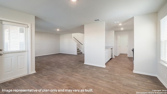 unfurnished room featuring hardwood / wood-style floors