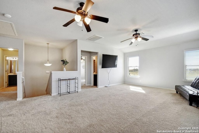 unfurnished living room featuring light carpet