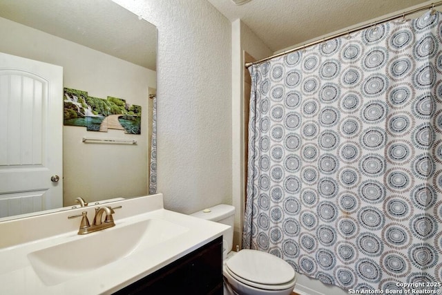 bathroom featuring vanity, a shower with curtain, a textured ceiling, and toilet