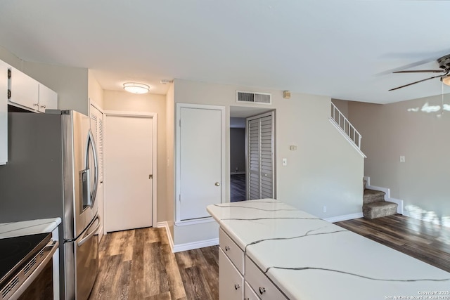 kitchen with white cabinetry, range with electric cooktop, dark hardwood / wood-style floors, and ceiling fan