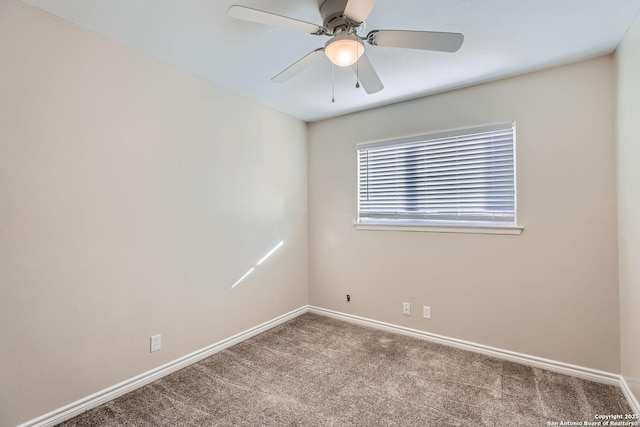 unfurnished room featuring ceiling fan and carpet