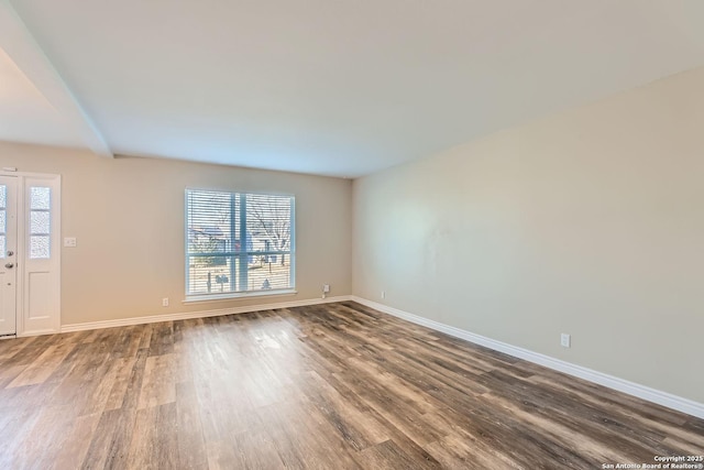 spare room with hardwood / wood-style floors