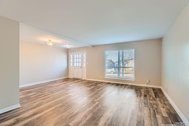 spare room with hardwood / wood-style floors