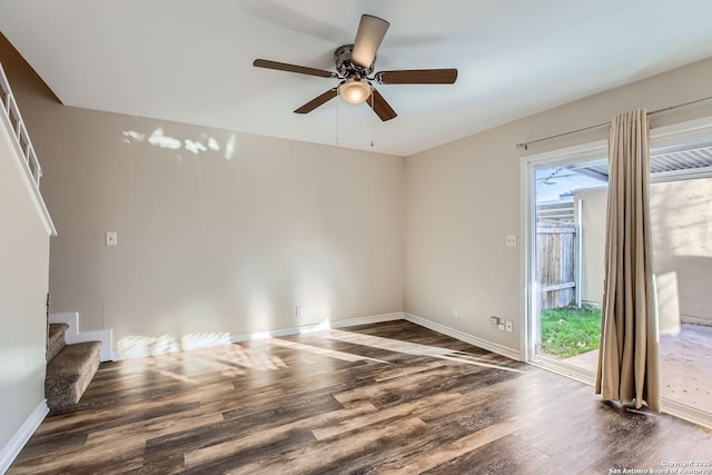 unfurnished room featuring ceiling fan and dark hardwood / wood-style floors