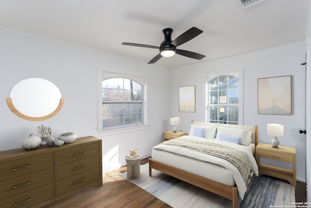 bedroom featuring light hardwood / wood-style floors and ceiling fan