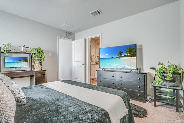 carpeted bedroom featuring connected bathroom