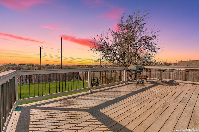 deck at dusk with a lawn