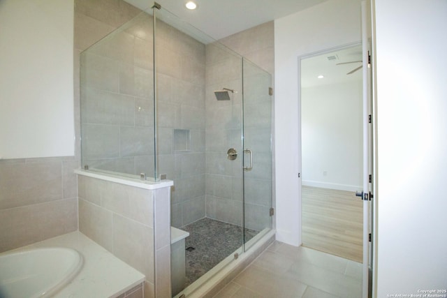1255 Canyon Lk, Canyon Lake, TX 78133 - full bathroom with a stall shower, tile patterned flooring, a bath, and recessed lighting