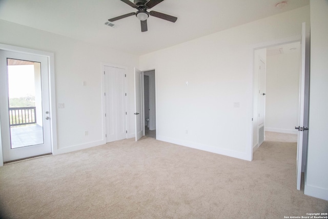 1255 Canyon Lk, Canyon Lake, TX 78133 - unfurnished room with light colored carpet, a ceiling fan, and baseboards