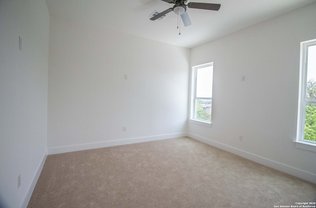 1255 Canyon Lk, Canyon Lake, TX 78133 - unfurnished room featuring light carpet, baseboards, and ceiling fan