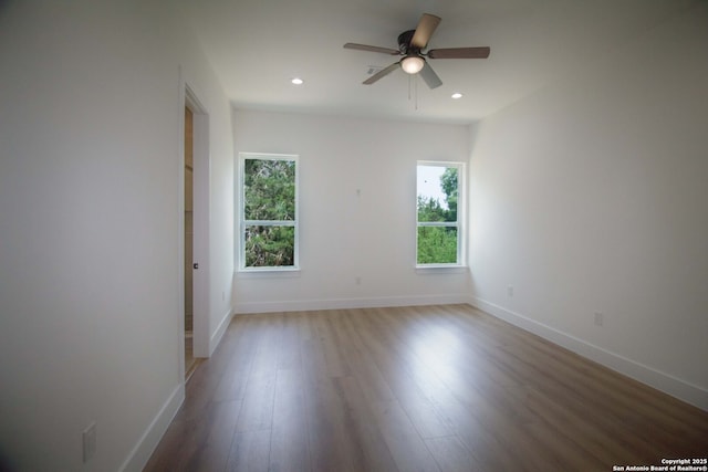 1255 Canyon Lk, Canyon Lake, TX 78133 - empty room featuring healthy amount of natural light, a ceiling fan, light wood-type flooring, baseboards, and recessed lighting