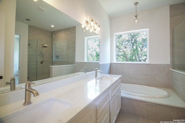 1255 Canyon Lk, Canyon Lake, TX 78133 - full bathroom with a shower stall, a bath, double vanity, and recessed lighting