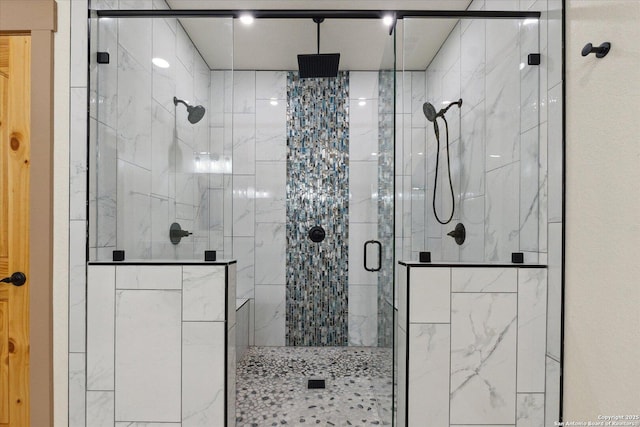 bathroom with a shower with shower door