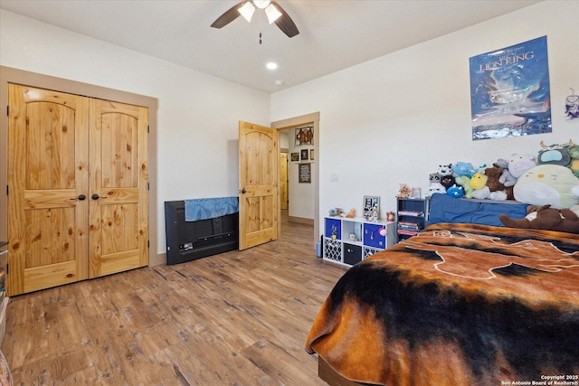 bedroom with hardwood / wood-style flooring and ceiling fan