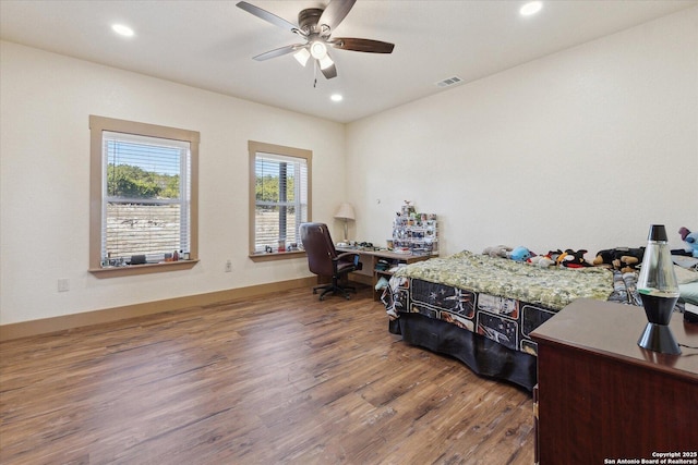 bedroom featuring ceiling fan and hardwood / wood-style floors