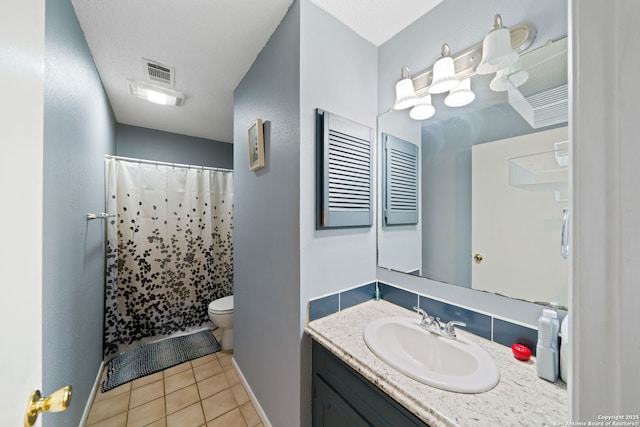 bathroom with walk in shower, tile patterned floors, toilet, a textured ceiling, and vanity