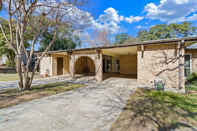 view of front of home featuring a carport