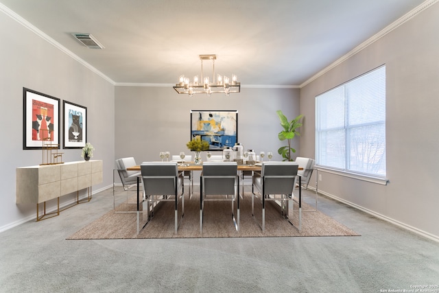 dining room featuring a notable chandelier, carpet floors, and ornamental molding