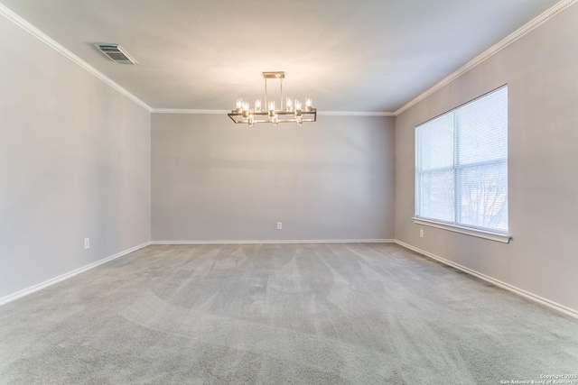 empty room featuring a notable chandelier, ornamental molding, and carpet flooring