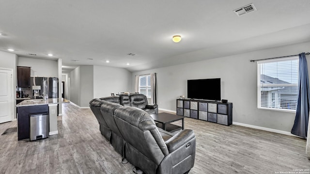 living room with light hardwood / wood-style flooring