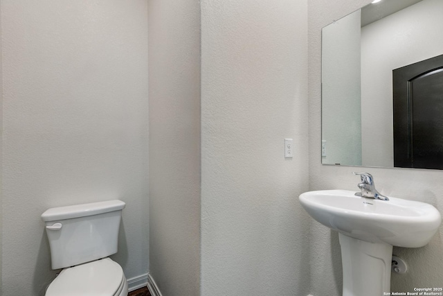 bathroom with sink and toilet