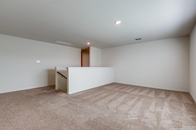 empty room with light colored carpet