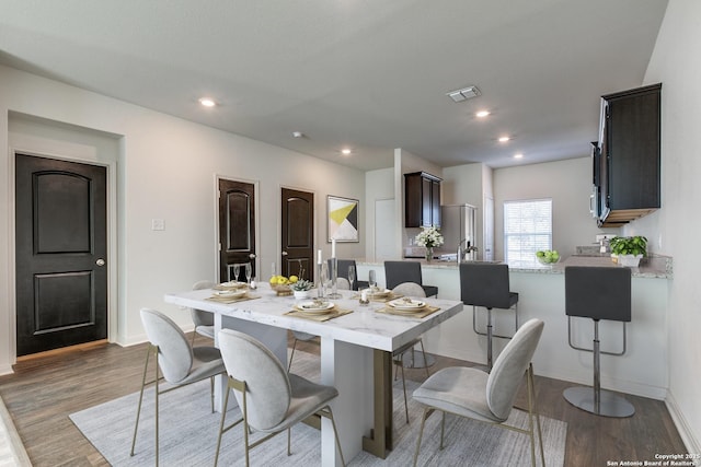 dining room with dark hardwood / wood-style flooring