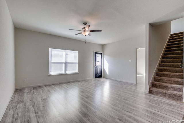 interior space with ceiling fan and light hardwood / wood-style floors