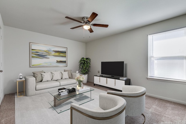 living room featuring ceiling fan and light carpet