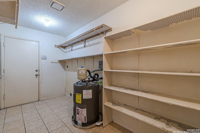 utility room featuring electric water heater