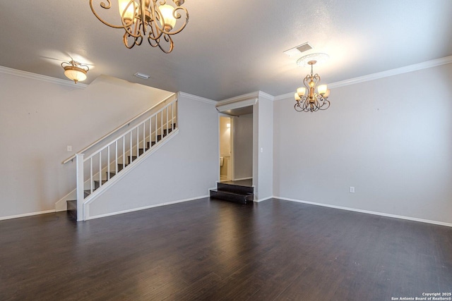 unfurnished living room featuring ornamental molding, dark hardwood / wood-style floors, and a notable chandelier