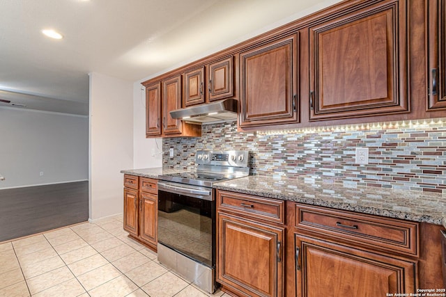 kitchen featuring decorative backsplash, stainless steel range with electric cooktop, stone counters, and light tile patterned flooring